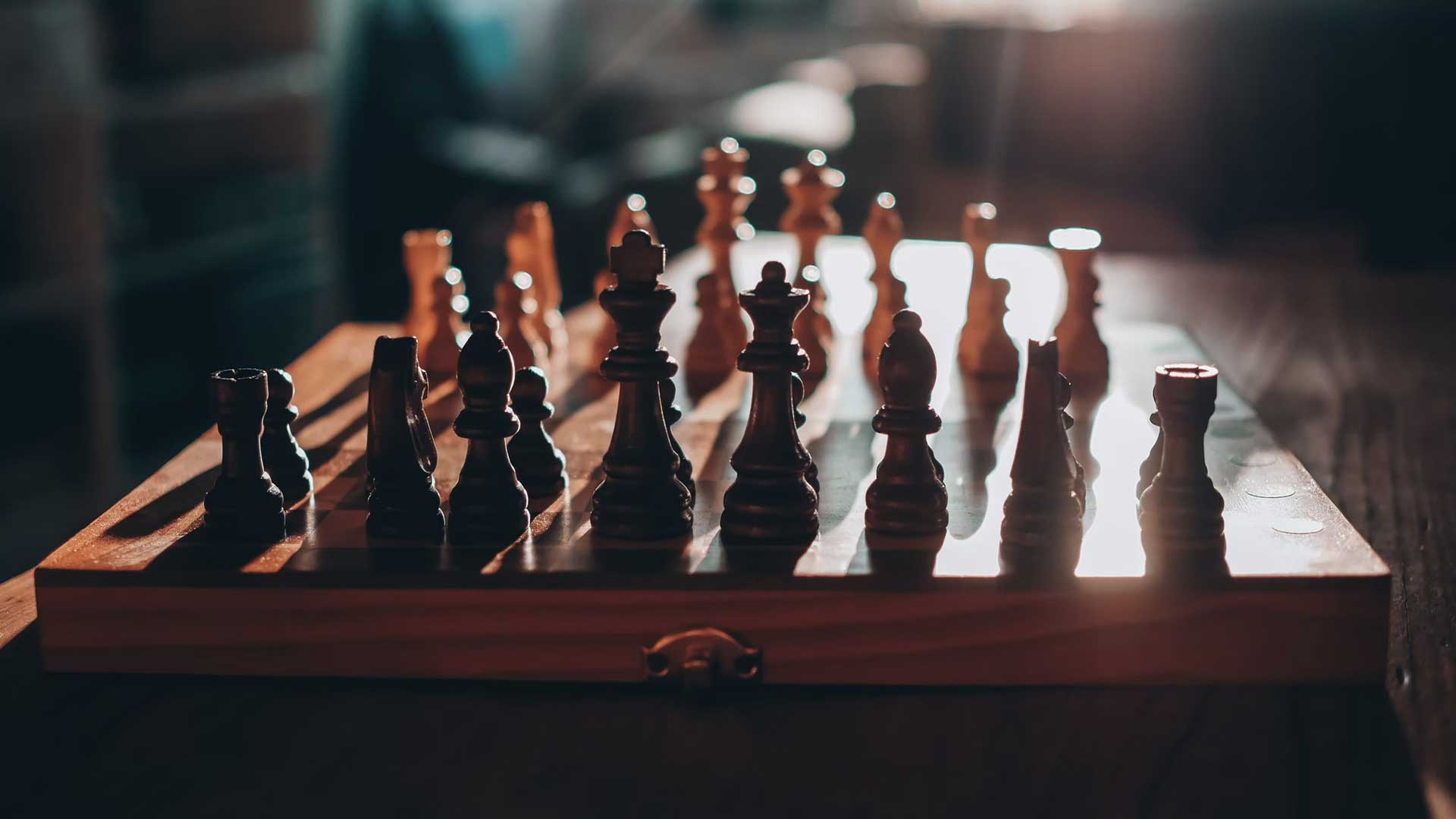 Close-up of a wooden chess board, untouched.